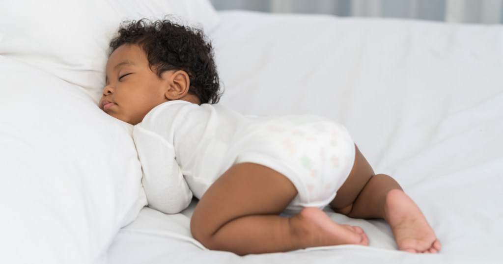 Baby sleeping deeply with their head on a comfortable soft pillow and the relaxing brown noise in the background.